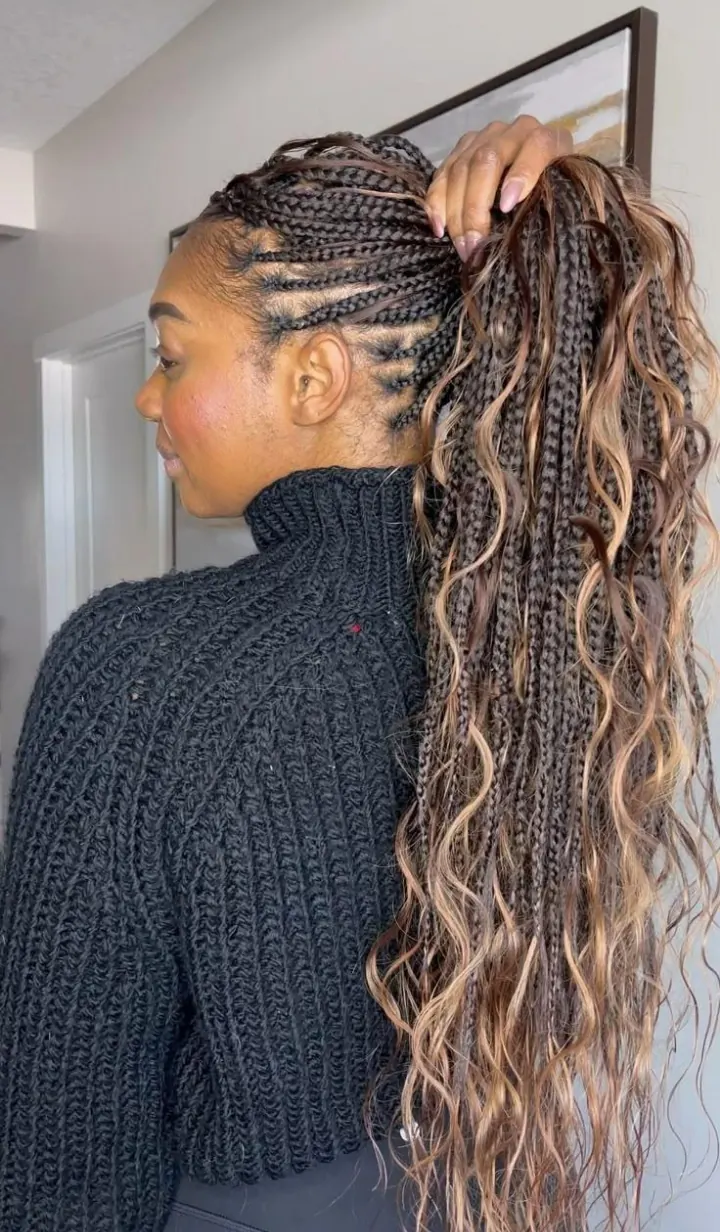 Boho cornrows into a long wavy braided ponytail with brown and blonde highlights by Ani Braids in Lanham, Maryland