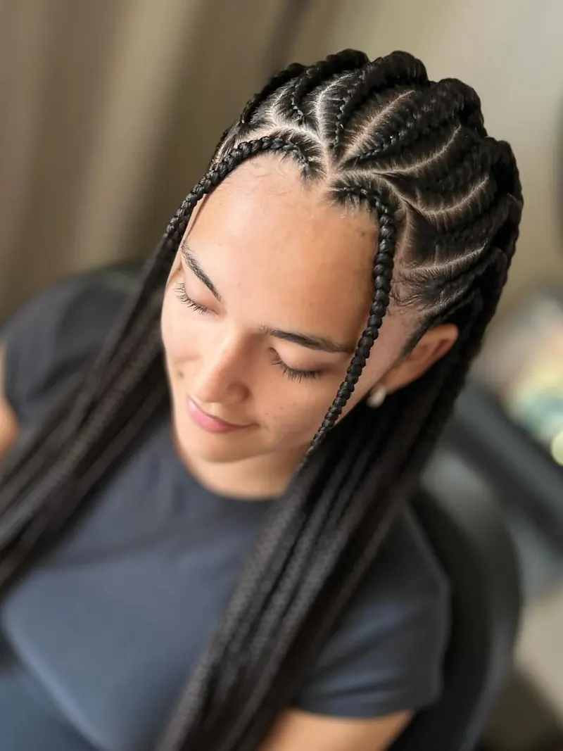 Intricate black cornrows with long knotless braids by Ani Braids in Lanham, Maryland